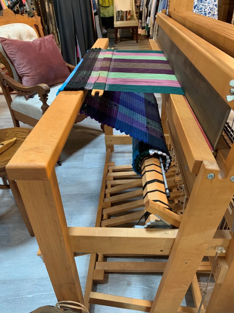 photo of loom with rug in process